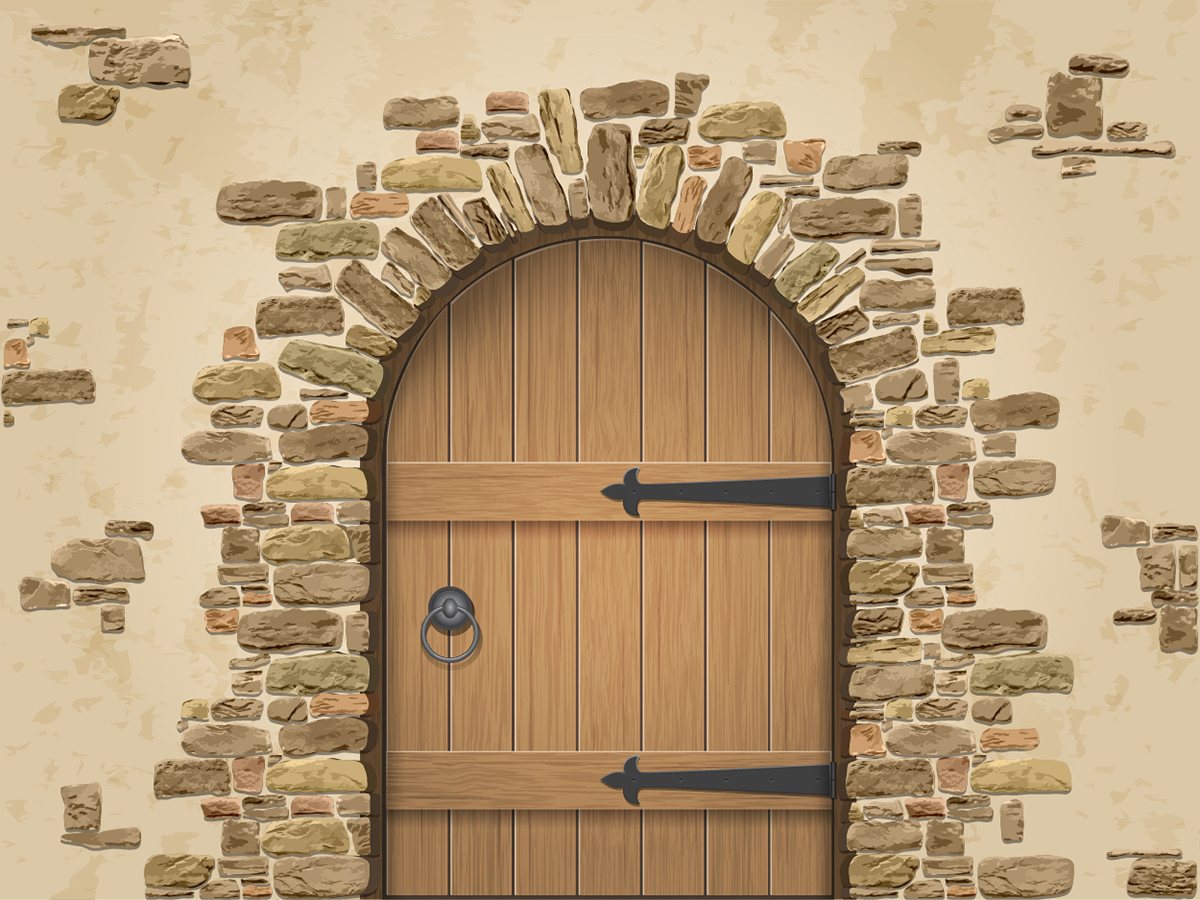A wooden door in a stone wall