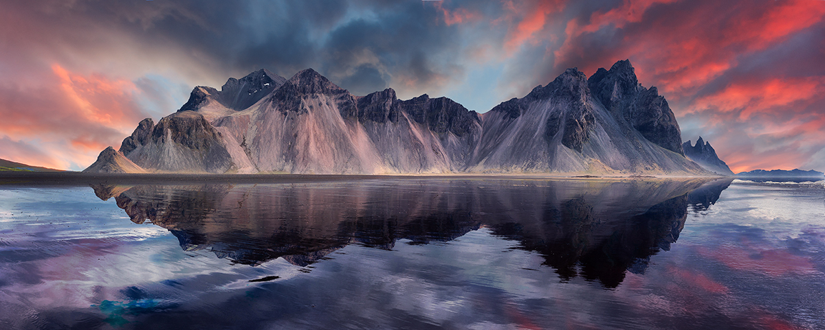 A mountain range with a body of water