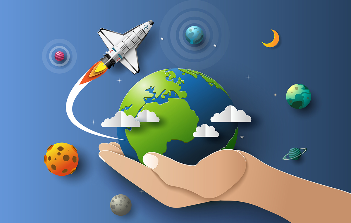 A hand holding a rocket and earth