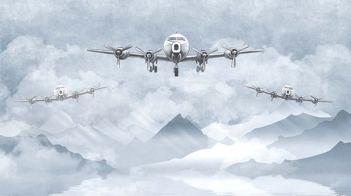 A group of airplanes flying over mountains