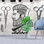 A drawing of a man with a beard and scissors on a wall