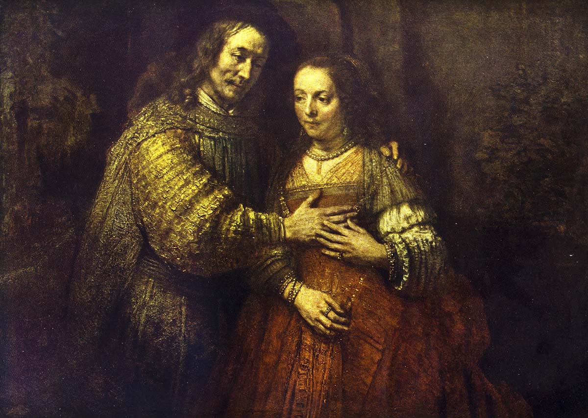 A man and woman in a gold dress