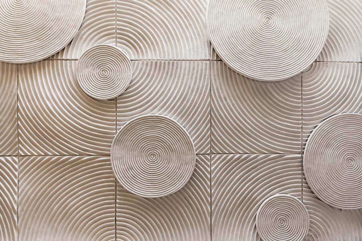 A white circular pattern on a wall