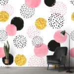 A pattern of pink black and gold circles