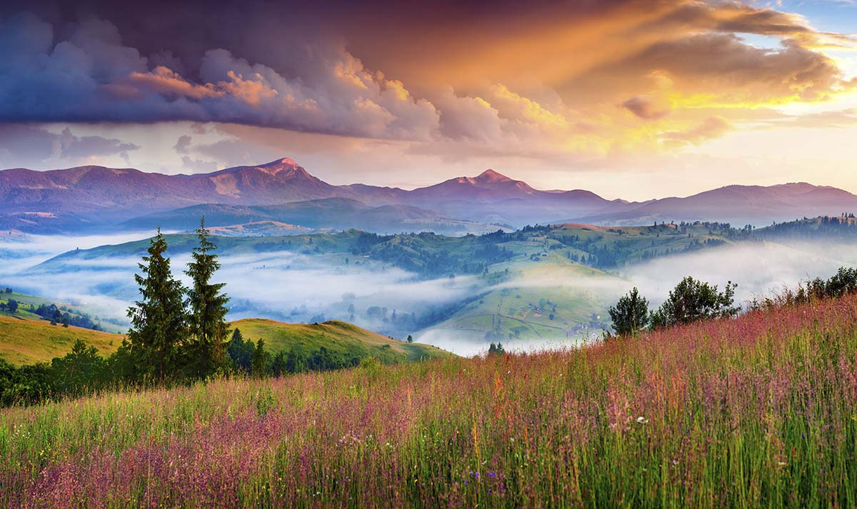 A landscape with mountains and clouds