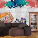 A wall with colorful doodles and a cartoon character