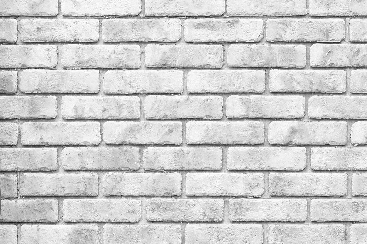 A white brick wall with many bricks