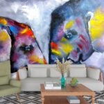 A painting of elephants with colorful paint