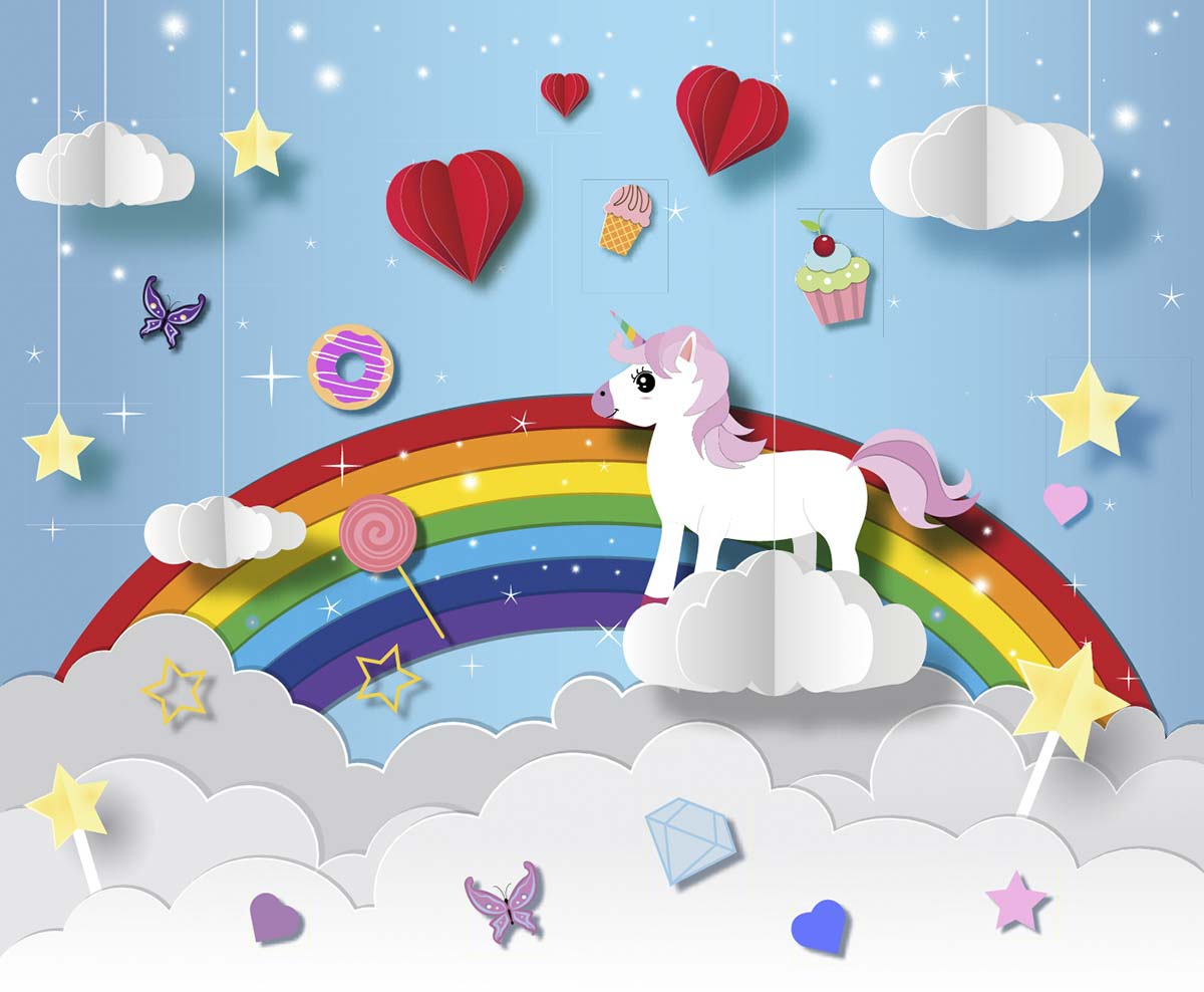 A paper cut out of a unicorn on a cloud with a rainbow and stars