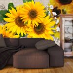 A group of sunflowers on a fabric surface