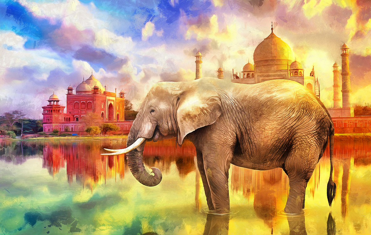 An elephant standing in water with buildings in the background