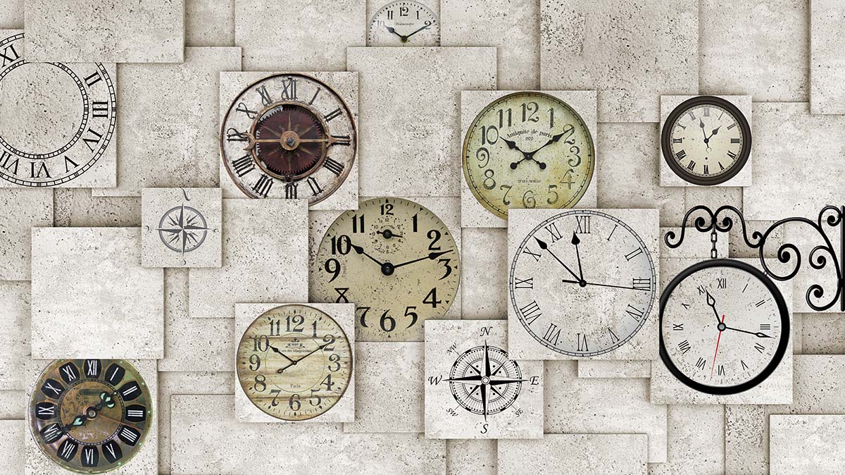 A group of clocks on a wall