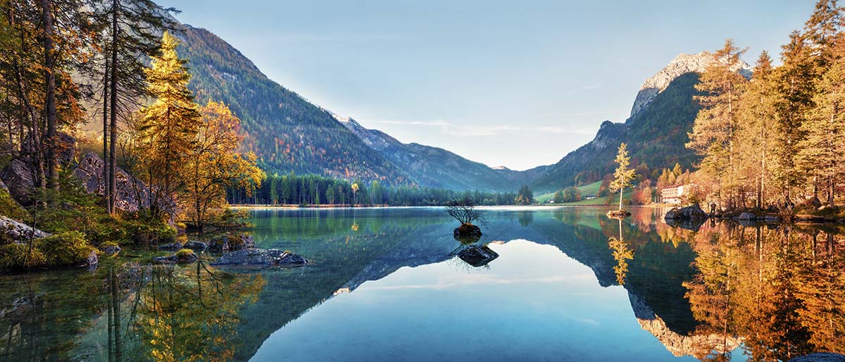 A lake with a rock in it