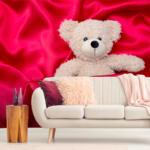 Teddy bear with red silk background